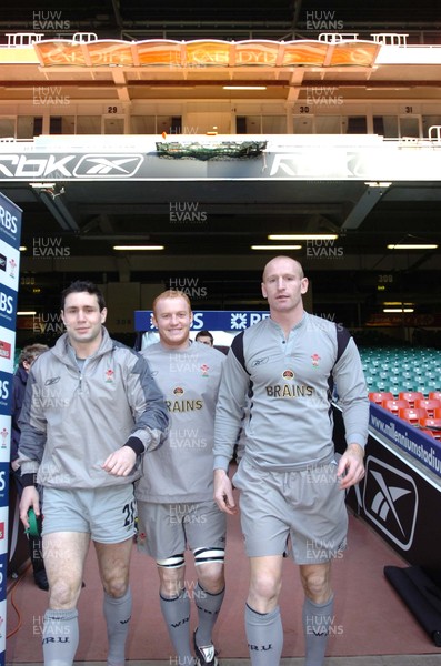 110206  Wales rugby training,Cardiff L-r Stephen Jones, Martyn Williams and captain Gareth Thomas walk out onto the pitch at the Millennium Stadium   