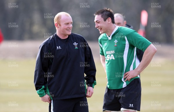 11.03.10 ... Wales rugby training session -  Wales' Martyn Williams (lt) shares a joke with Gareth Delve 