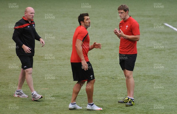 11.08.11 - Wales Rugby Training - Gavin Henson talks to Rhys Priestland(R) and kicking coach Neil Jenkins during training. 