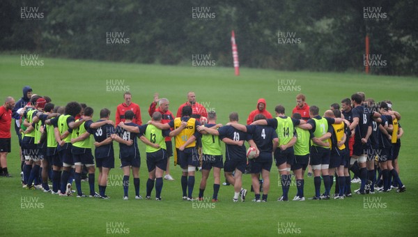 11.08.11 - Wales Rugby Training - Head coach Warren Gatland talks to players during training. 