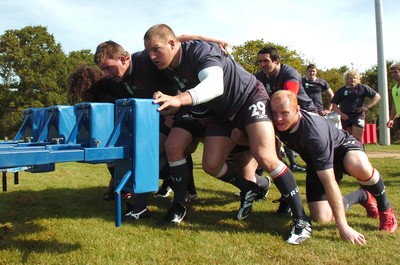 12.09.07 - Wales Rugby World Cup Training - Wales' Forwards coach, Robin Mcbryde puts (l-r)Adam Jones, Matthew Rees, Gethin Jenkins and Martyn Williams through their paces on the scrum machine 