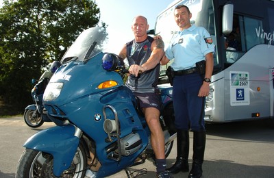 12.09.07 - Wales Rugby World Cup Training - Gareth Thomas takes a closer look at a Gendarmerie motor bike after training 