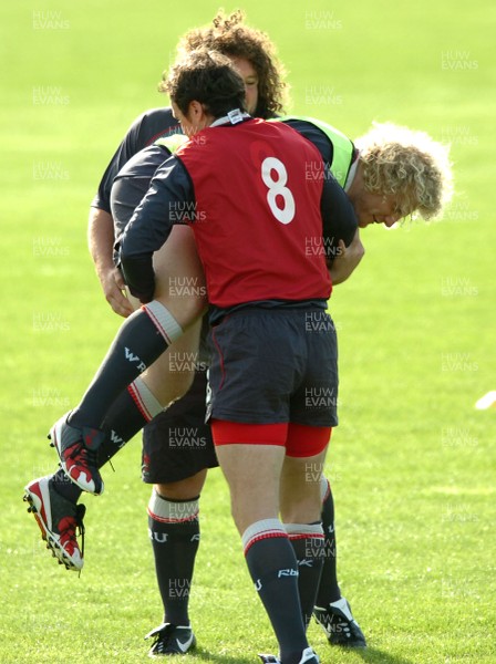 12.09.07 - Wales Rugby World Cup Training - Duncan Jones is tackled by Mark Jones and Adam Jones 