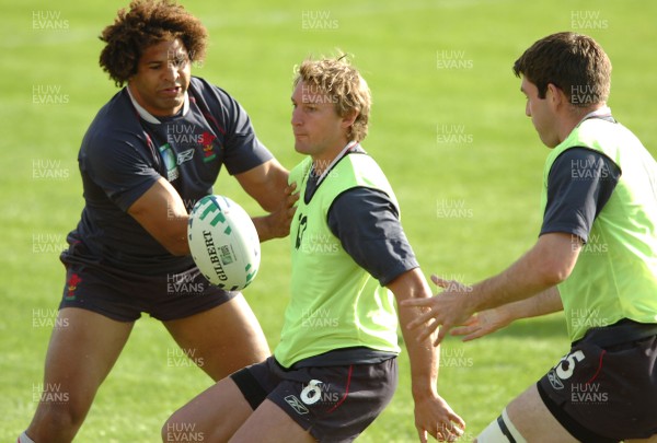 12.09.07 - Wales Rugby World Cup Training - Jamie Robinson is tackled by Colin charvis during training 