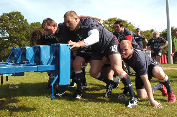 12.09.07 - Wales Rugby World Cup Training - Wales' Forwards coach, Robin Mcbryde puts (l-r)Adam Jones, Matthew Rees, Gethin Jenkins and Martyn Williams through their paces on the scrum machine 