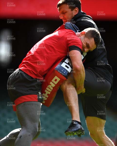 130320 - Wales Rugby Training - George North hits a tackle bag held by Sam Warburton during training