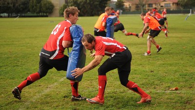 13.06.10 - Wales Rugby Training - Will Harries hits Jonathan Davies tackle bag during training. 