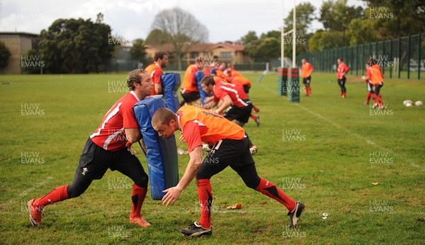 13.06.10 - Wales Rugby Training - Richie Rees hits Will Harries tackle bag during training. 