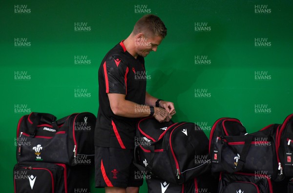 130622 - Wales Rugby Training - Gareth Anscombe picks up his kit bag during the first day of camp