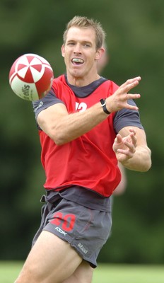 13.08.07 -  Wales Rugby Training - Dafydd James passes during training  