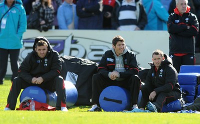 13.09.11 - Wales Rugby Training - Huw Bennett, James Hook and Shane Williams look on during training. 