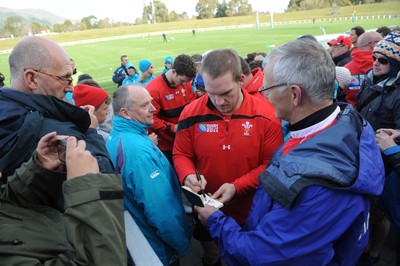 13.09.11 - Wales Rugby Training - Gethin Jenkins signs autographs for fans during an open training session. 