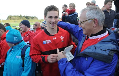 13.09.11 - Wales Rugby Training - George North signs autographs for fans during an open training session. 
