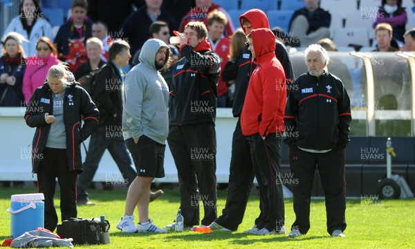 13.09.11 - Wales Rugby Training - Adam Jones, Ryan Jones, Luke Charteris and Dan Lydiate look on during training. 