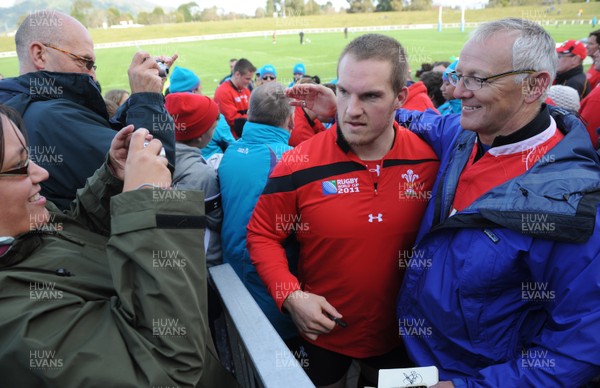 13.09.11 - Wales Rugby Training - Gethin Jenkins has his picture taken with fans during an open training session. 