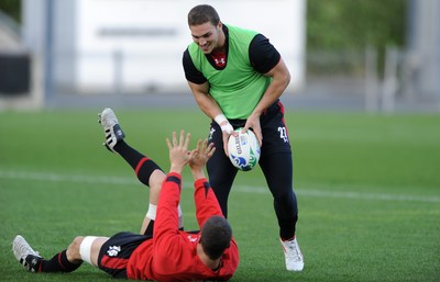 13.10.11 - Wales Rugby Training - Sam Warburton(ground) and George North during training. 