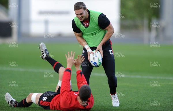13.10.11 - Wales Rugby Training - Sam Warburton(ground) and George North during training. 