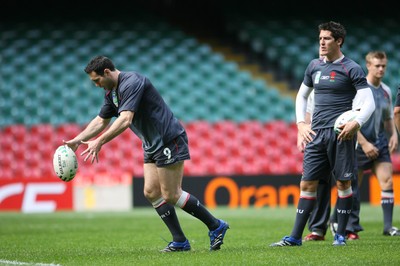 14.09.07 Wales rugby training. RWC2007... Stephen Jones kicking during training watched by James Hook. 
