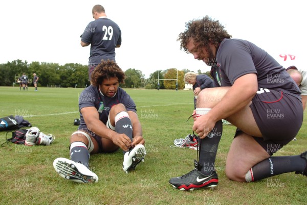 14.09.07 - Wales Rugby World Cup Training - Colin Charvis(L) and Adam Jones put on their boots as they prepare for training 
