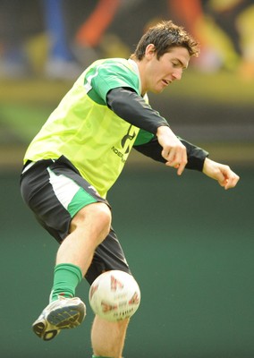 16.03.09 - Wales Rugby Training - James Hook plays with a football during training. 