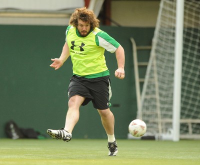 16.03.09 - Wales Rugby Training - Adam Jones plays with a football during training. 