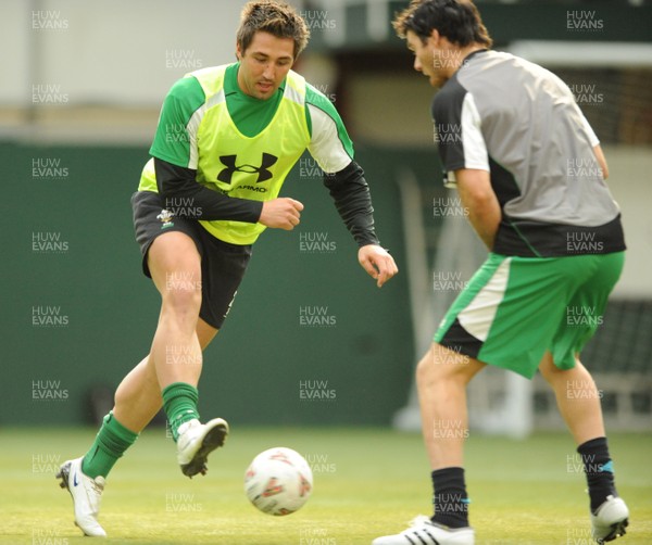 16.03.09 - Wales Rugby Training - Gavin Henson is tackled by Mike Phillips as they play with a football during training. 