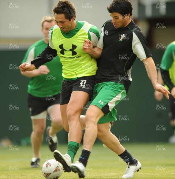 16.03.09 - Wales Rugby Training - Gavin Henson is tackled by Mike Phillips as they play with a football during training. 
