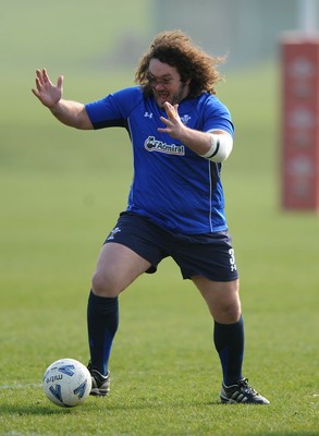 16.03.11 - Wales Rugby Training - Adam Jones plays football during training. 