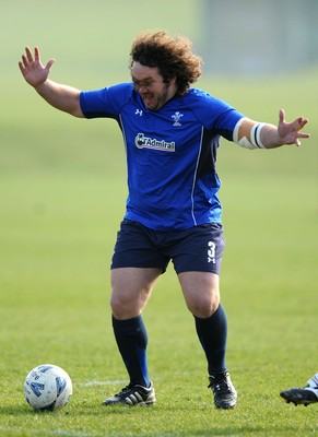 16.03.11 - Wales Rugby Training - Adam Jones plays football during training. 