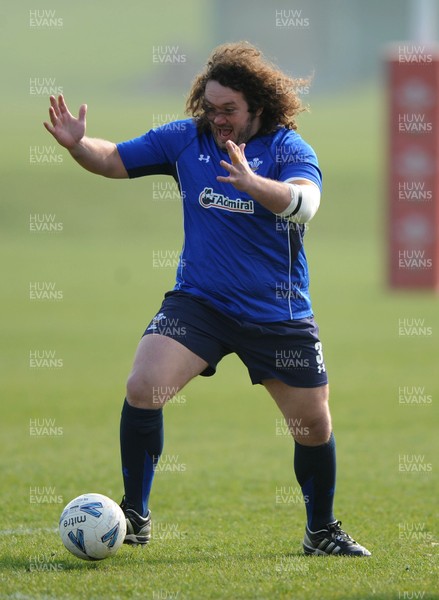 16.03.11 - Wales Rugby Training - Adam Jones plays football during training. 