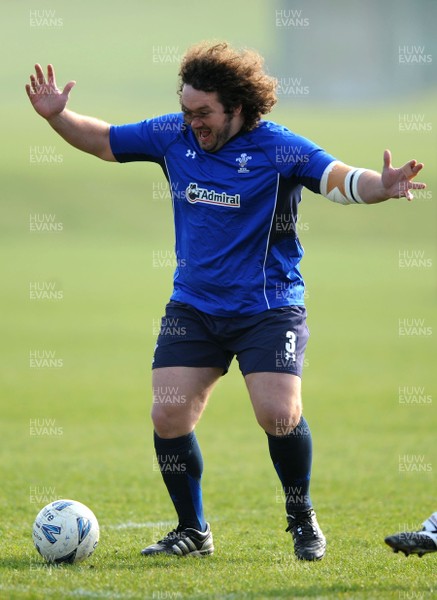 16.03.11 - Wales Rugby Training - Adam Jones plays football during training. 