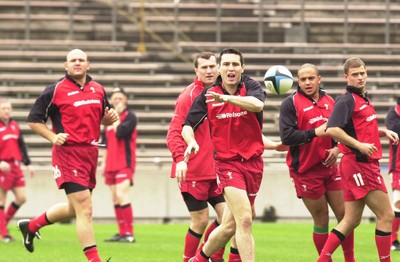 160601 - Wales Rugby Training - Stephen Jones passes watched by l-r Craig Quinnell, Geraint Lewis, Gavin Thomas and Adrian Durston