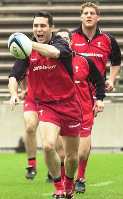 160601 - Wales Rugby Training - Stephen Jones passes watched by captain Andy Moore