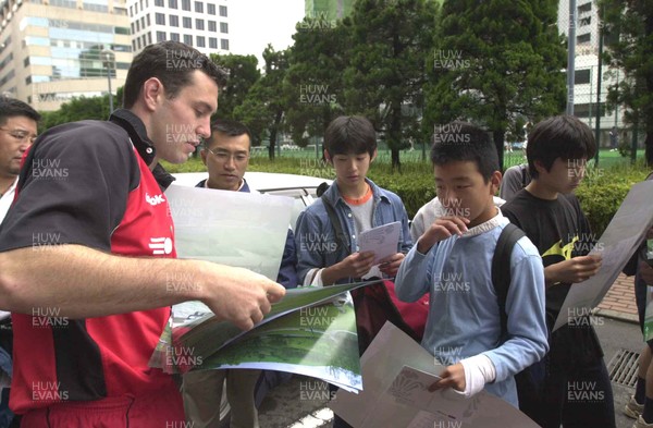 160601 - Wales Rugby Training - Stephen Jones hands out signed posters at training in Tokyo
