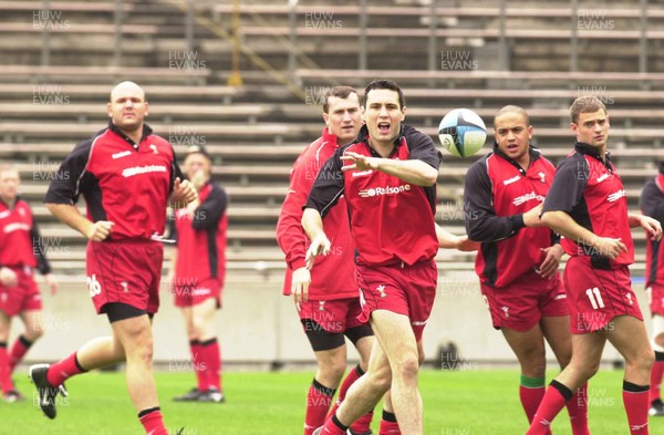 160601 - Wales Rugby Training - Stephen Jones passes watched by l-r Craig Quinnell, Geraint Lewis, Gavin Thomas and Adrian Durston