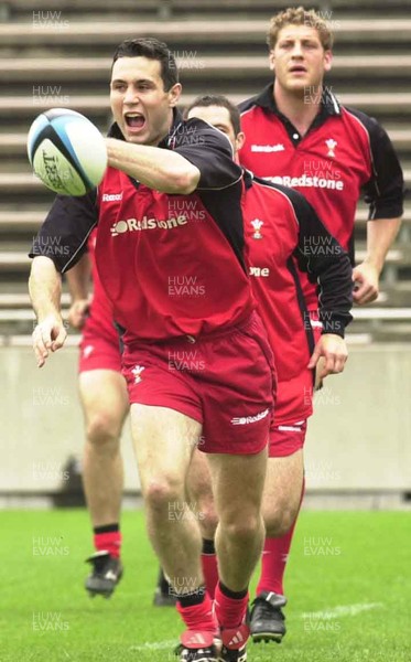 160601 - Wales Rugby Training - Stephen Jones passes watched by captain Andy Moore