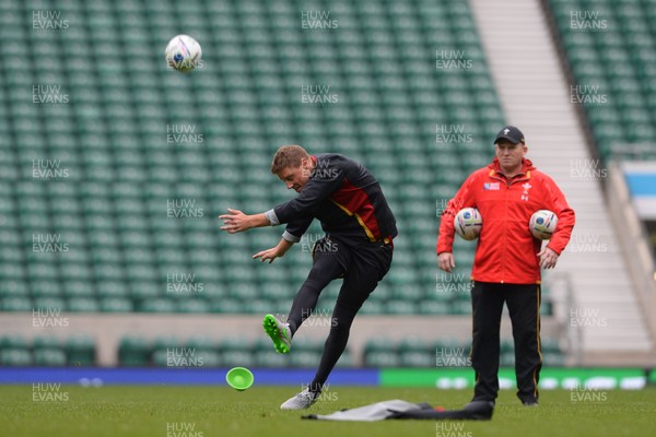 161015 - Wales Rugby Training -Rhys Priestland kicks as Neil Jenkins looks on during training