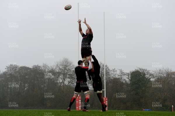161121 - Wales Rugby Training - Ben Carter is lifted by Seb Davies and Christ Tshiunza during training