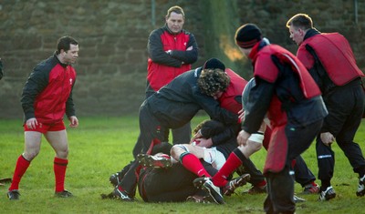 170203 - Wales Rugby Training - Steve Hansen looks on as players go through training session