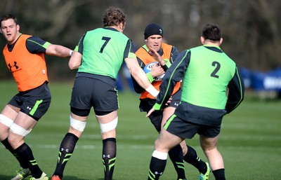 170315 - Wales Rugby Training -Jamie Roberts is tackled by Alun Wyn Jones and Rob Evans during training