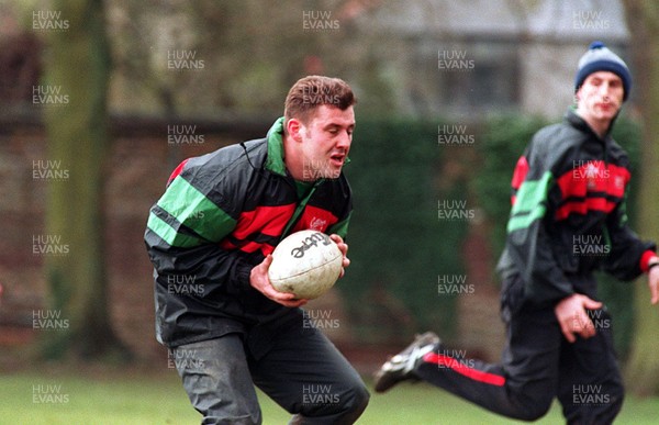 170395 - Wales Rugby Training - Matthew Back takes a ball watched by Wayne Proctor during training