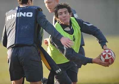 18.02.08 - Wales Rugby Training - James Hook is tackled by Mark Jones(L) during training 