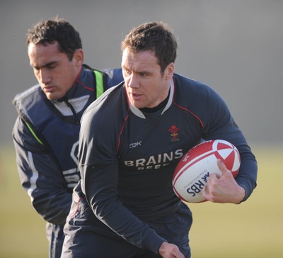 18.02.08 - Wales Rugby Training - Mark Jones is tackled by Sonny Parker during training 