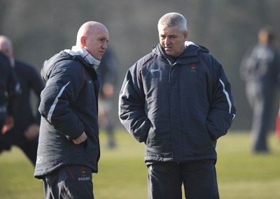 18.02.08 - Wales Rugby Training - Wales Head Coach, Warren Gatland(R) and Defence coach, Shaun Edwards look on during training 