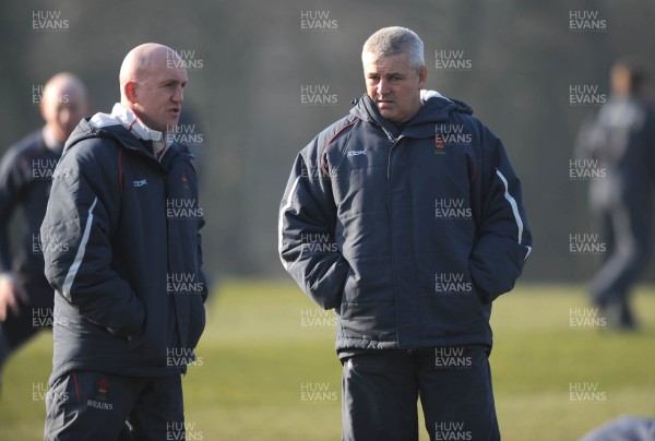 18.02.08 - Wales Rugby Training - Wales Head Coach, Warren Gatland(R) and Defence coach, Shaun Edwards look on during training 