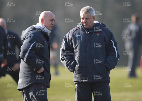 18.02.08 - Wales Rugby Training - Wales Head Coach, Warren Gatland(R) and Defence coach, Shaun Edwards look on during training 