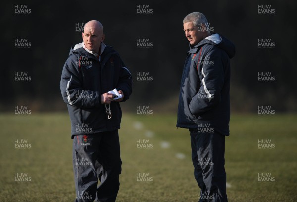 18.02.08 - Wales Rugby Training - Wales Head Coach, Warren Gatland(R) and Defence coach, Shaun Edwards look on during training 