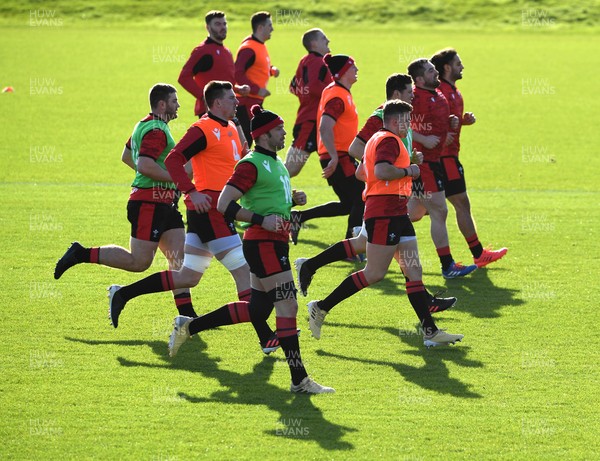 180221 - Wales Rugby Training - Players warm up during training