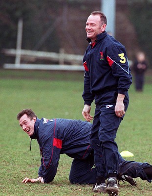 180298 - Wales Rugby Training -  Ieuan Evans (right) with captain Rob Howley during today's training session before Evans pulled out of the team through injury