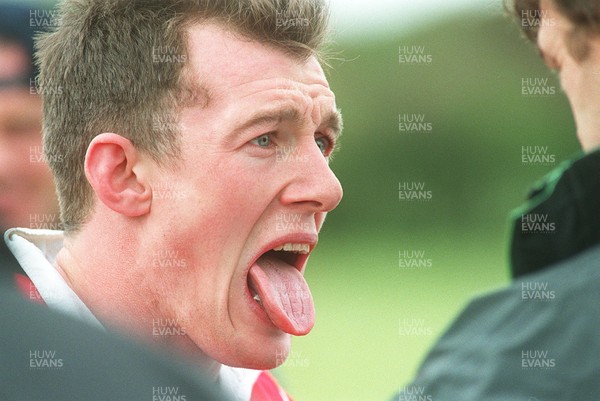 180596 - Wales Rugby Training - Rob Howley receives attention after wasp stung his tongue